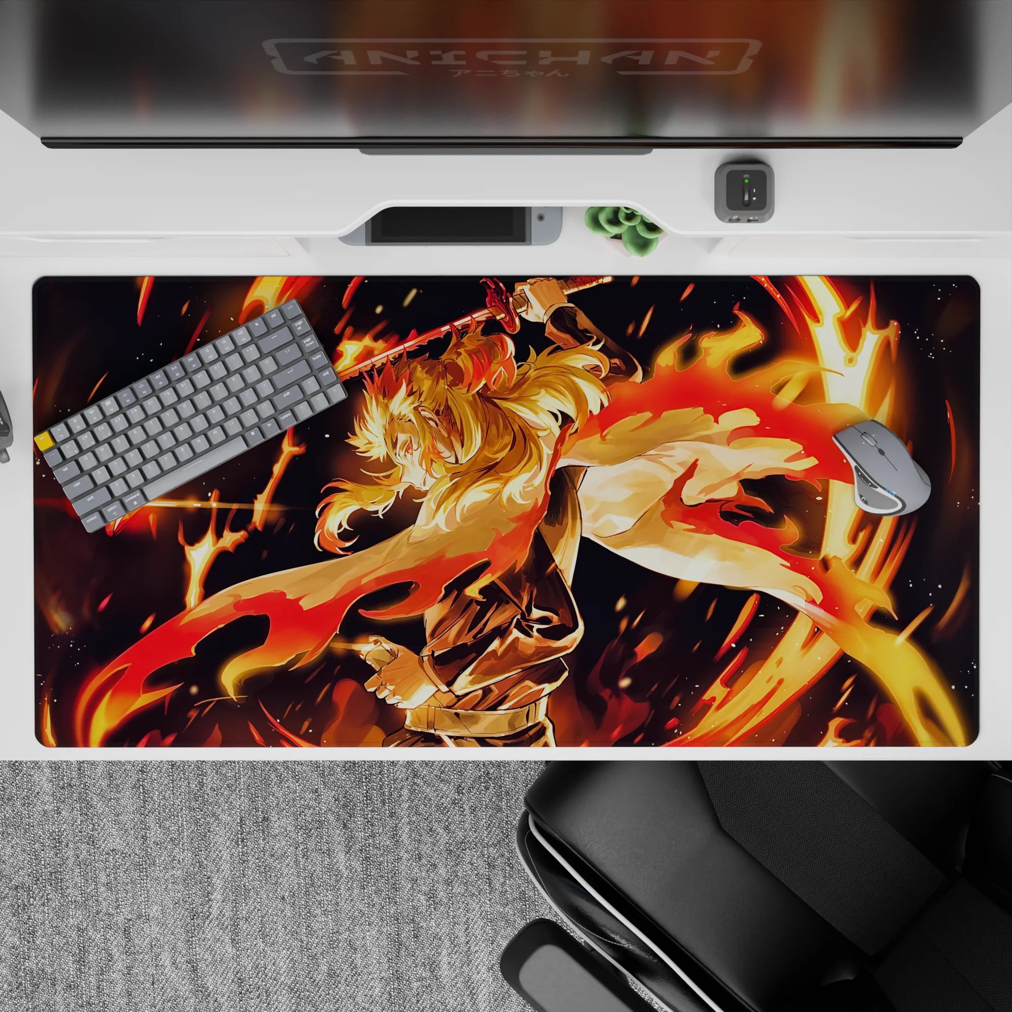 Rengoku anime desk pad 40x20 inches with blazing colors from Demon Slayer, featuring fiery hair and dynamic sword pose.