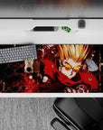 36x16 inches anime desk pad in hot reds and deep blacks, gritty high-energy action vibe for gaming.