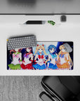 28x12 inches anime girl mouse pad in emerald, crimson, ocean blue, and sunny orange with spark effects.