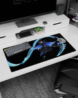 Cat-eared anime warrior gripping a glowing scythe with hex patterns on mouse pad 32x16 inches.