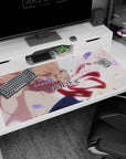 Violet Evergarden in profile as wind tugs her crimson ribbon, anime desk pad 40x20 inches.