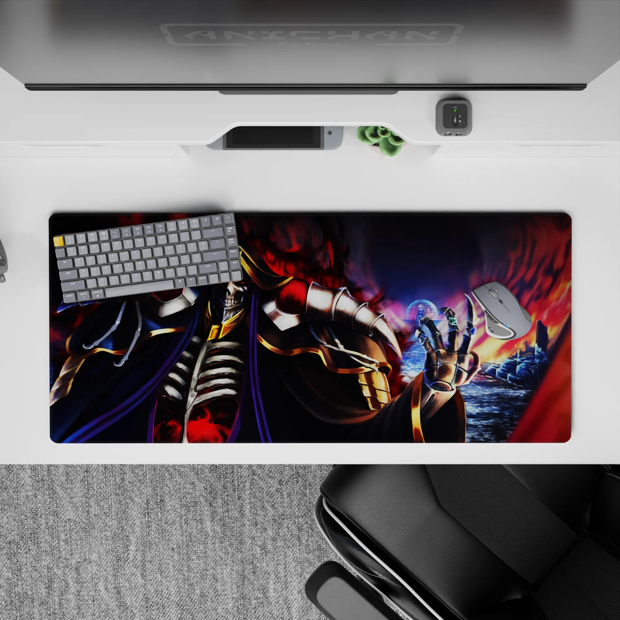 Ainz Ooal Gown anime desk pad, 36x16 inches, featuring Ainz in blackened bone armor amidst flames and violet shadows.