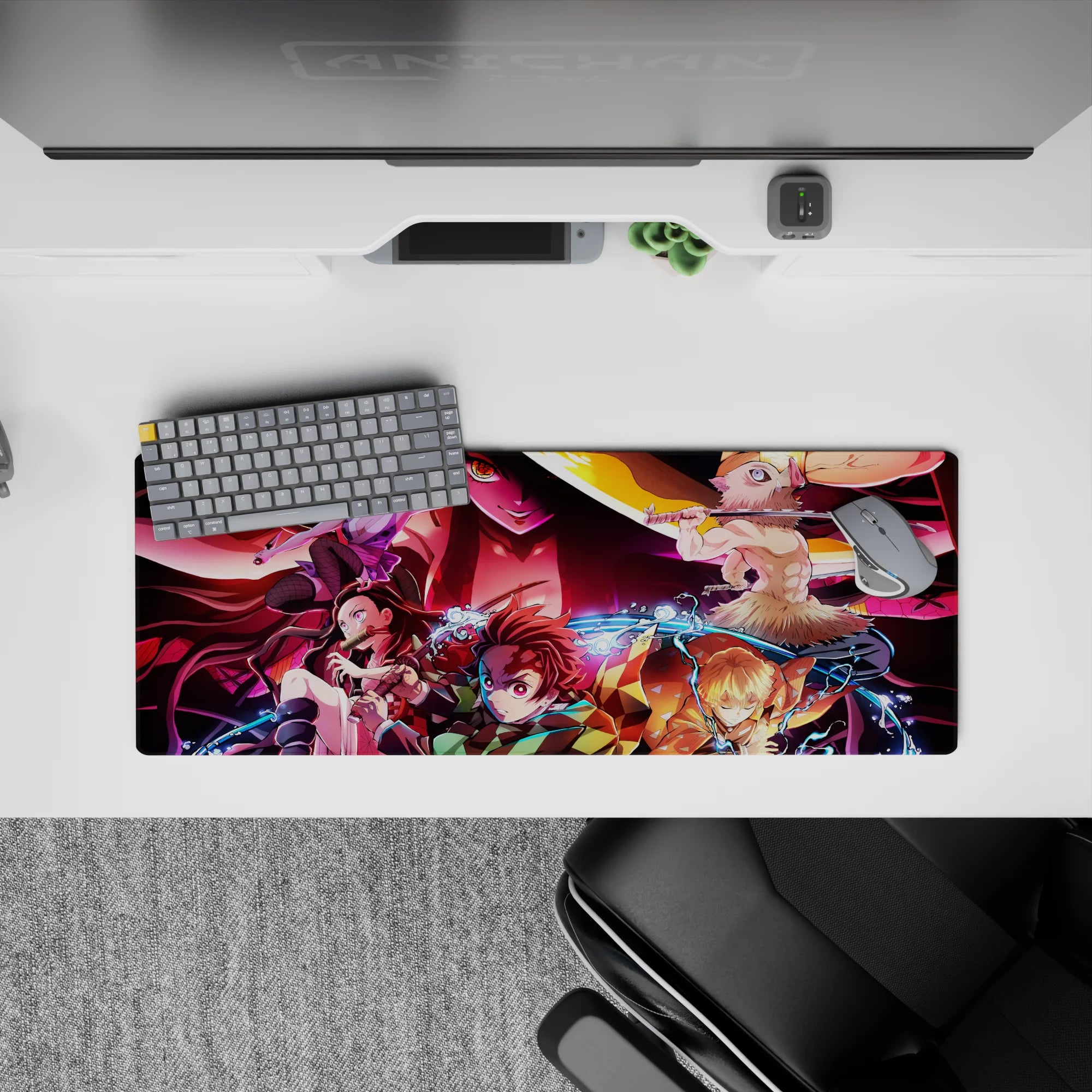 Anime mouse pad 32x12 inches featuring Demon Slayer characters Tanjiro, Nezuko, Zenitsu, Inosuke battling Daki.