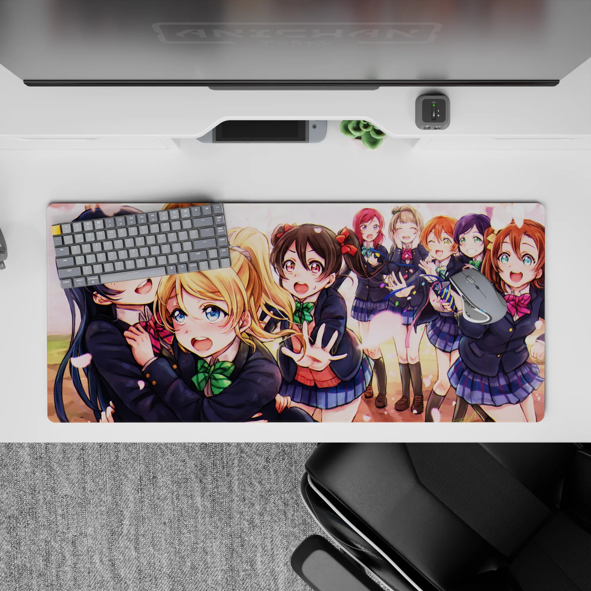 Spring sunset pink petals and bright bows on an anime desk pad 36x16 inches, cheerful and cozy.