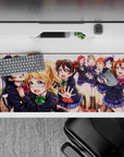 Spring sunset pink petals and bright bows on an anime desk pad 36x16 inches, cheerful and cozy.