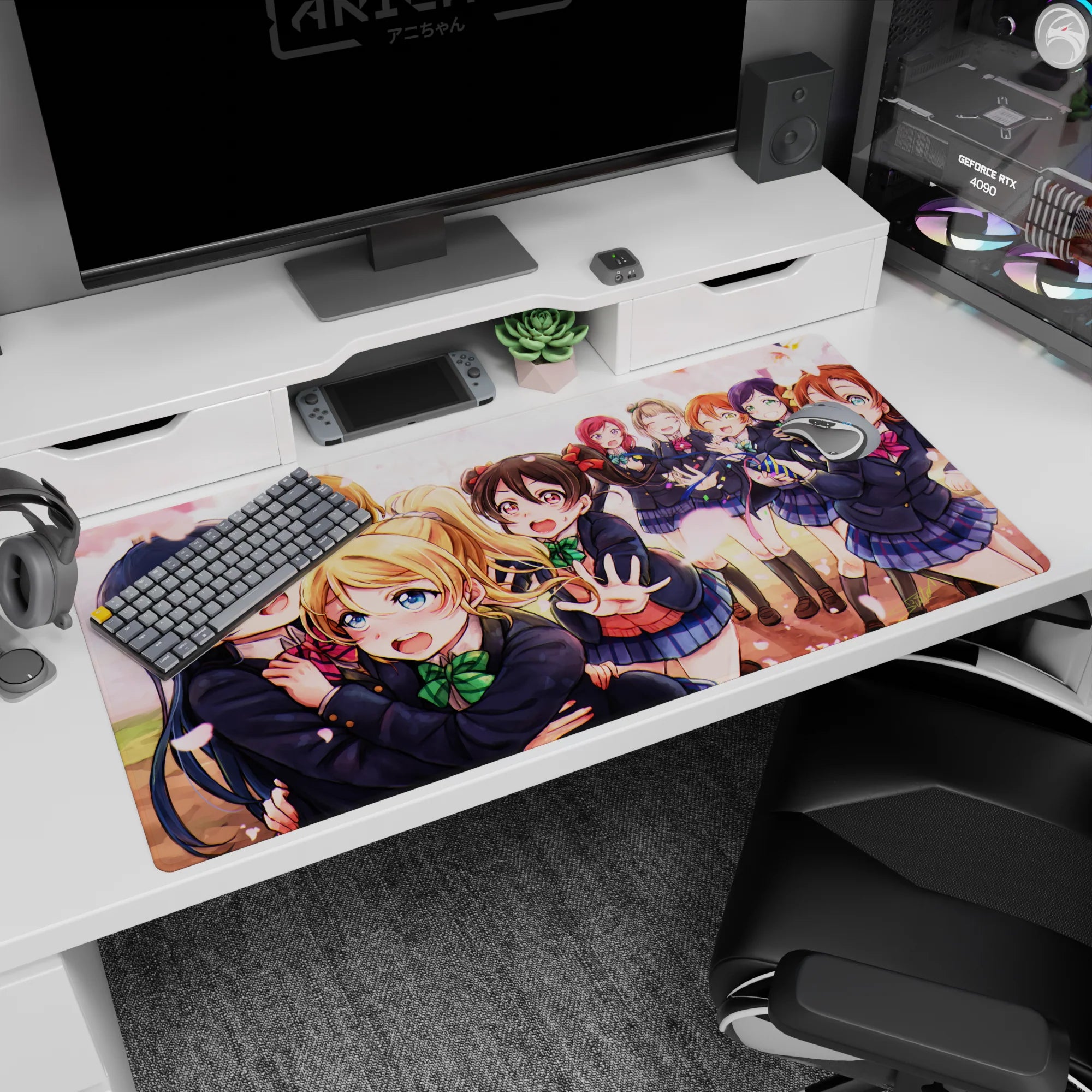 40x20 inches anime desk pad showing Umi hugging Eli while Nico reaches out, lively school idol moment.