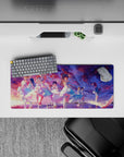 28x12 inches anime girl desk mat in sunset violets, cotton-candy pink, and ocean blues, dreamy finale vibe.