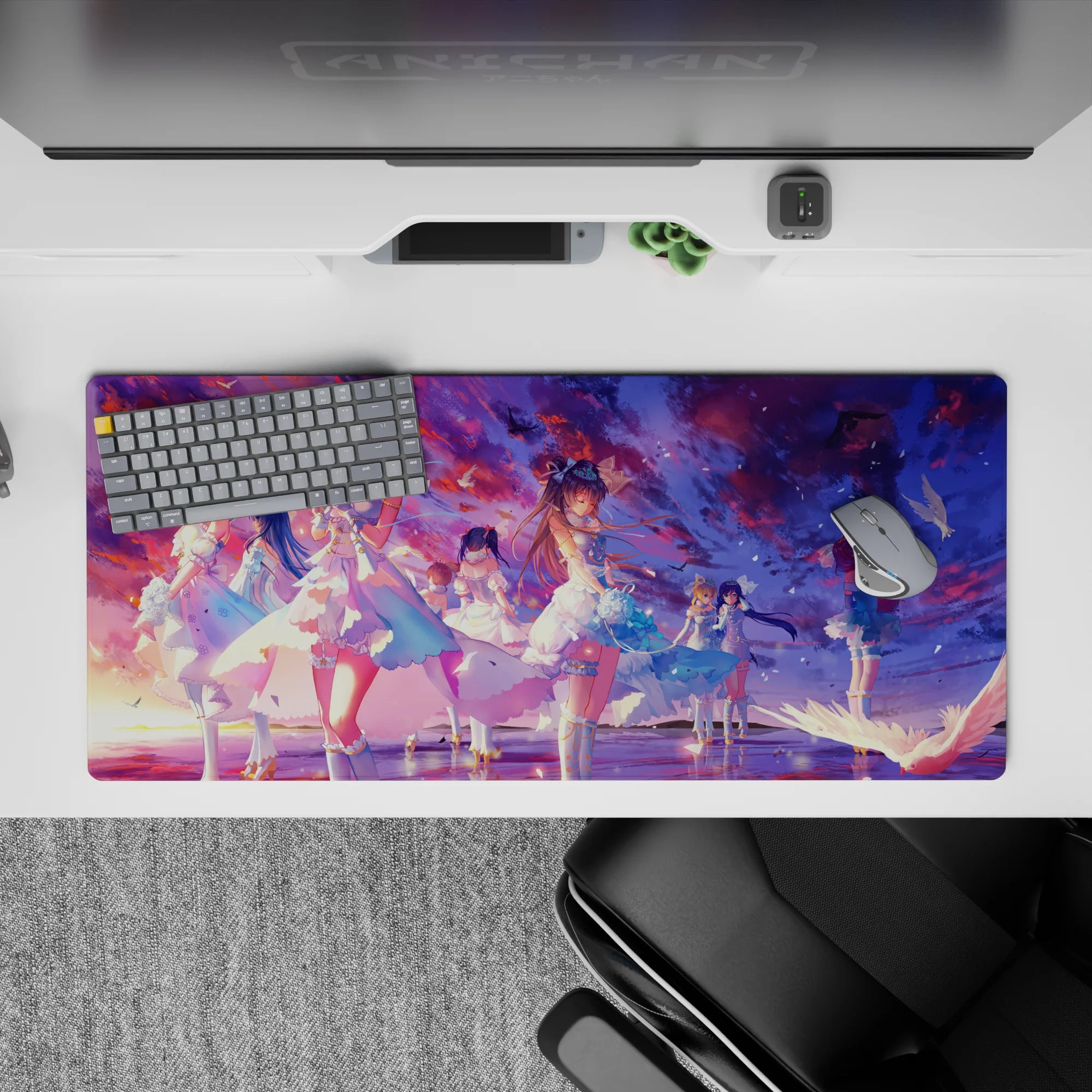 36x16 inches anime desk pad in sunset violets, cotton-candy pink, and ocean blues with dreamy concert vibe.