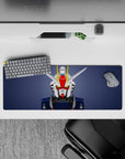 Slate background anime mouse pad 32x12 inches with white and navy armor, red faceplate, yellow V-fin.