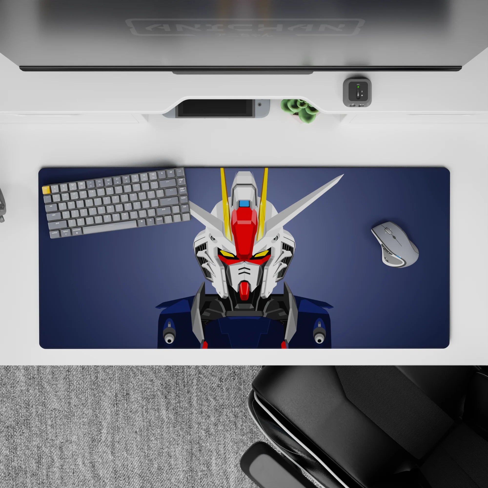 Slate background desk pad 36x16 inches with clean white/navy armor, red faceplate, yellow V-fin.