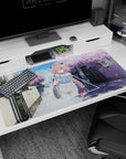 Shy pink-haired anime girl with long braid on quiet cherry blossom street desk pad 40x20 inches.