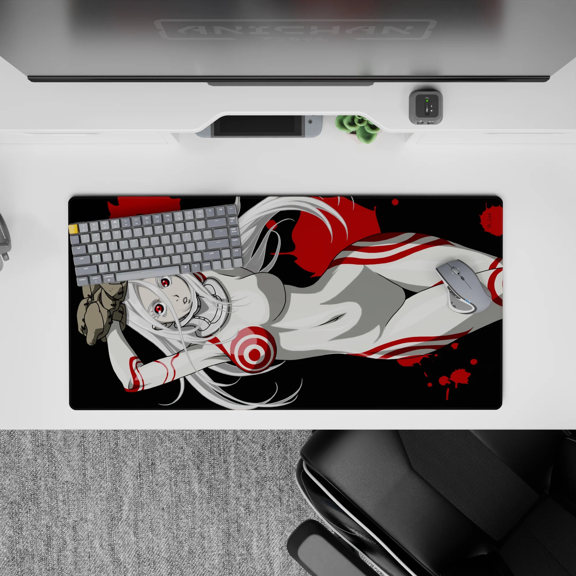 32x16 inches anime desk mat in black, white, and crimson; edgy candy-ink splatter vibe with sharp red eyes.