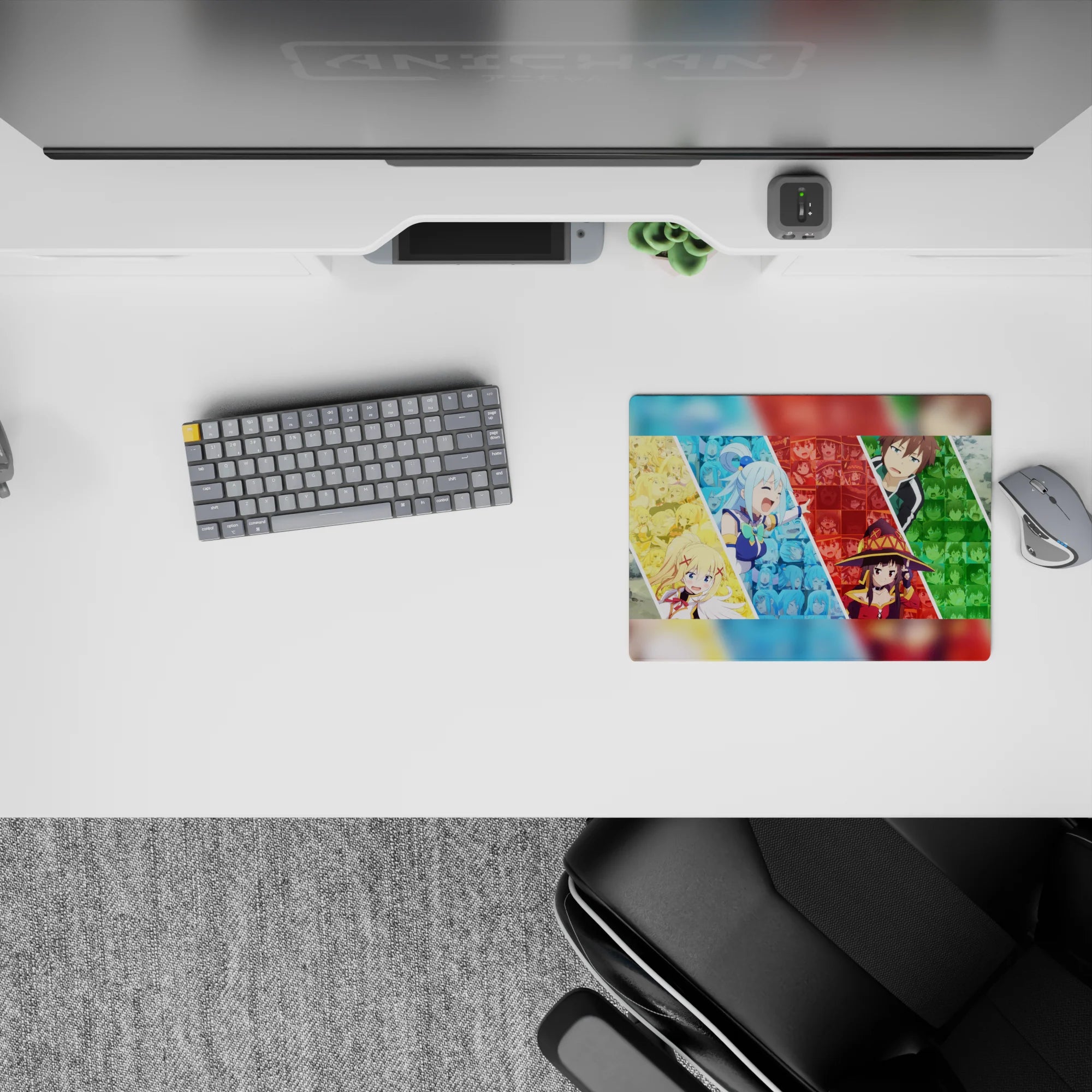 KonoSuba mouse pad 14x10 inches featuring Aqua, Darkness, Megumin, and Kazuma in a colorful, chaotic collage.