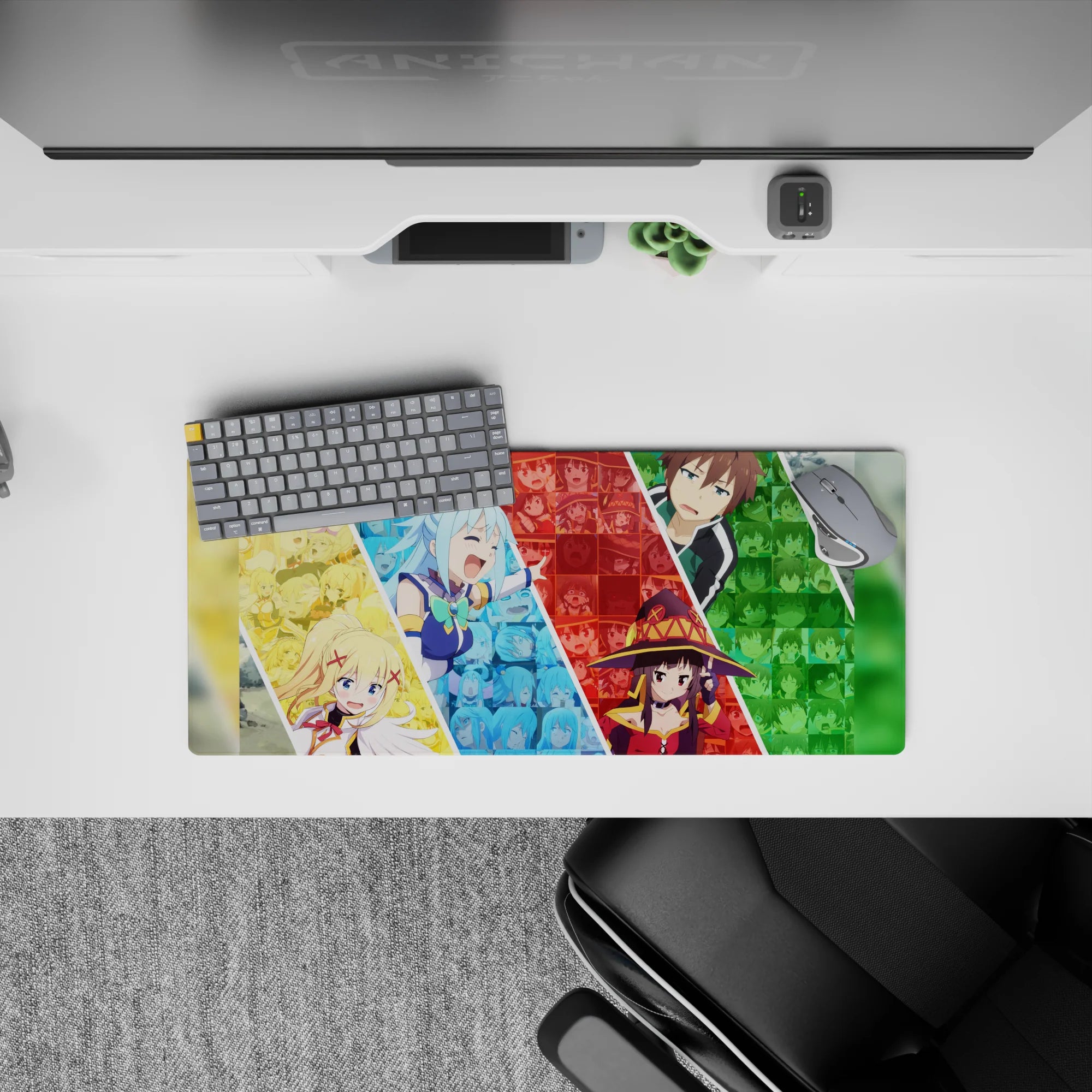 KonoSuba anime mouse pad 28x12 inches featuring Aqua, Darkness, Megumin, and Kazuma in a colorful, chaotic collage.