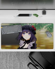 32x16 inches desk mouse pad in deep purple and black with dreamy violet eyes, warm calm green background.