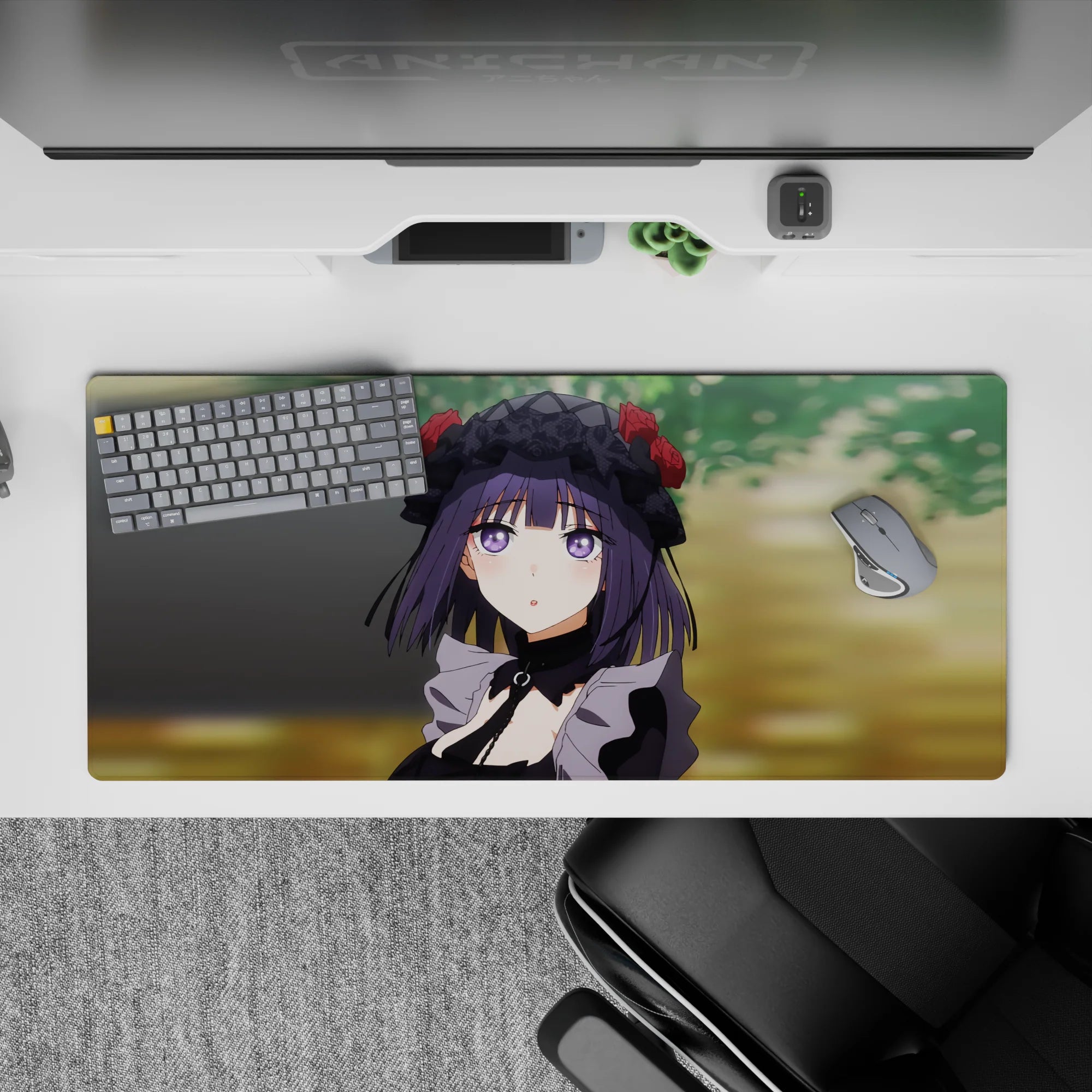 Soft violet and black anime desk pad 36x16 inches, cozy mischievous mood with warm blurred green background.