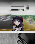 Soft violet and black anime desk pad 36x16 inches, cozy mischievous mood with warm blurred green background.