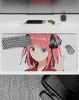 32x16 inches anime girl mouse pad in candy pink, white, black ribbons and teal accents, sweet smug vibe.