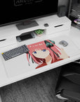 36x16 inches Nino Nakano desk pad, sweet smug expression, pink hair, black bows, perfect for work setup.