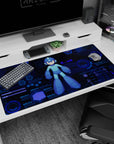 Mega Man anime desk pad 40x20 inches, bold center pose with gleaming helmet over neon HUD backdrop.