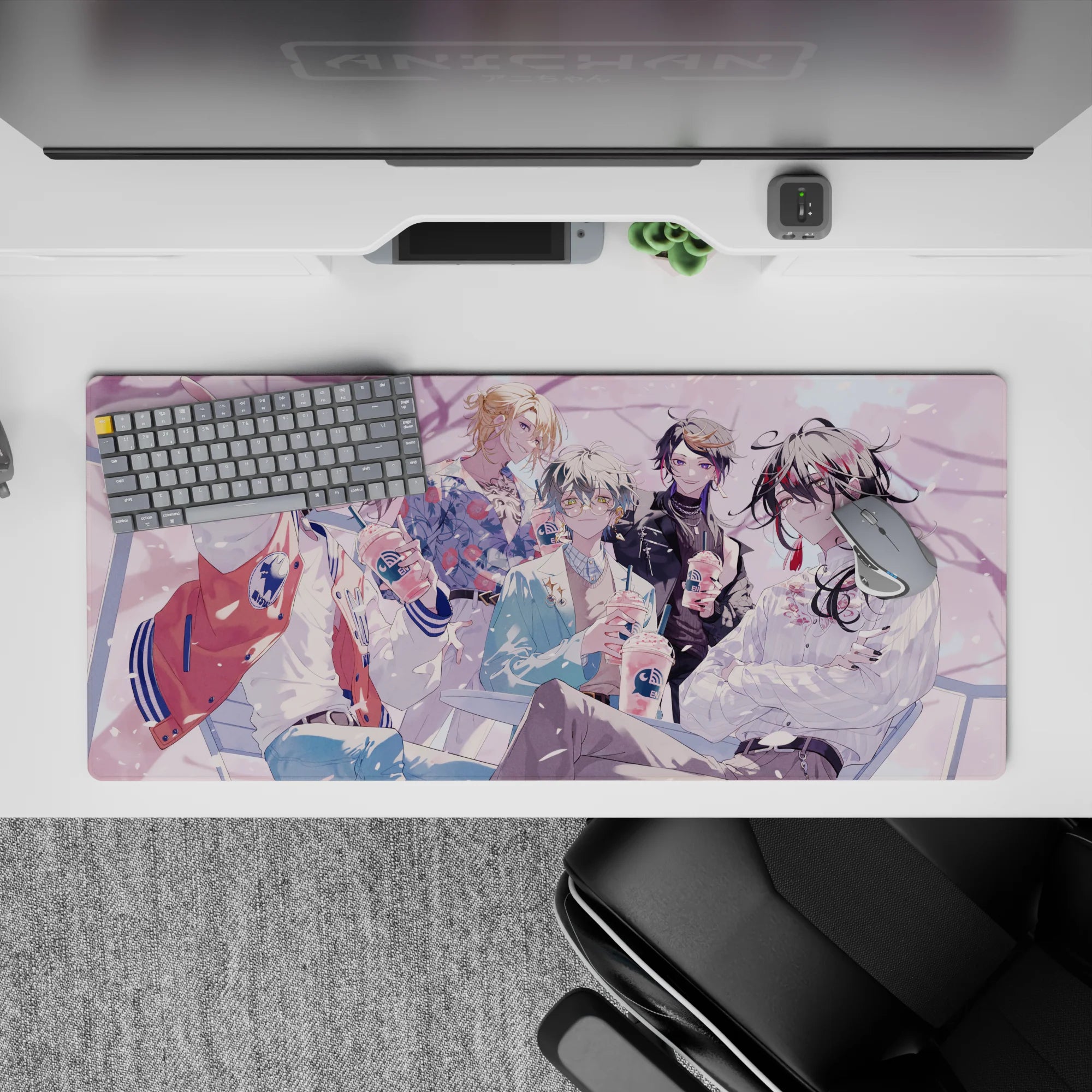36x16 inches pastel anime desk pad with soft pink petals, cozy café lighting, crisp linework.