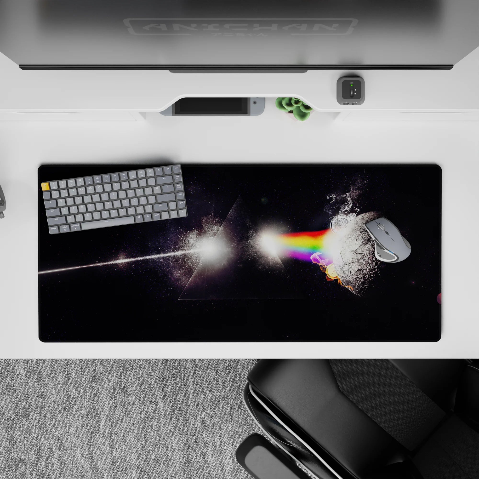 Moody deep-black desk pad 36x16 inches with smoky rainbow glow and playful sci-fi starlight vibe.