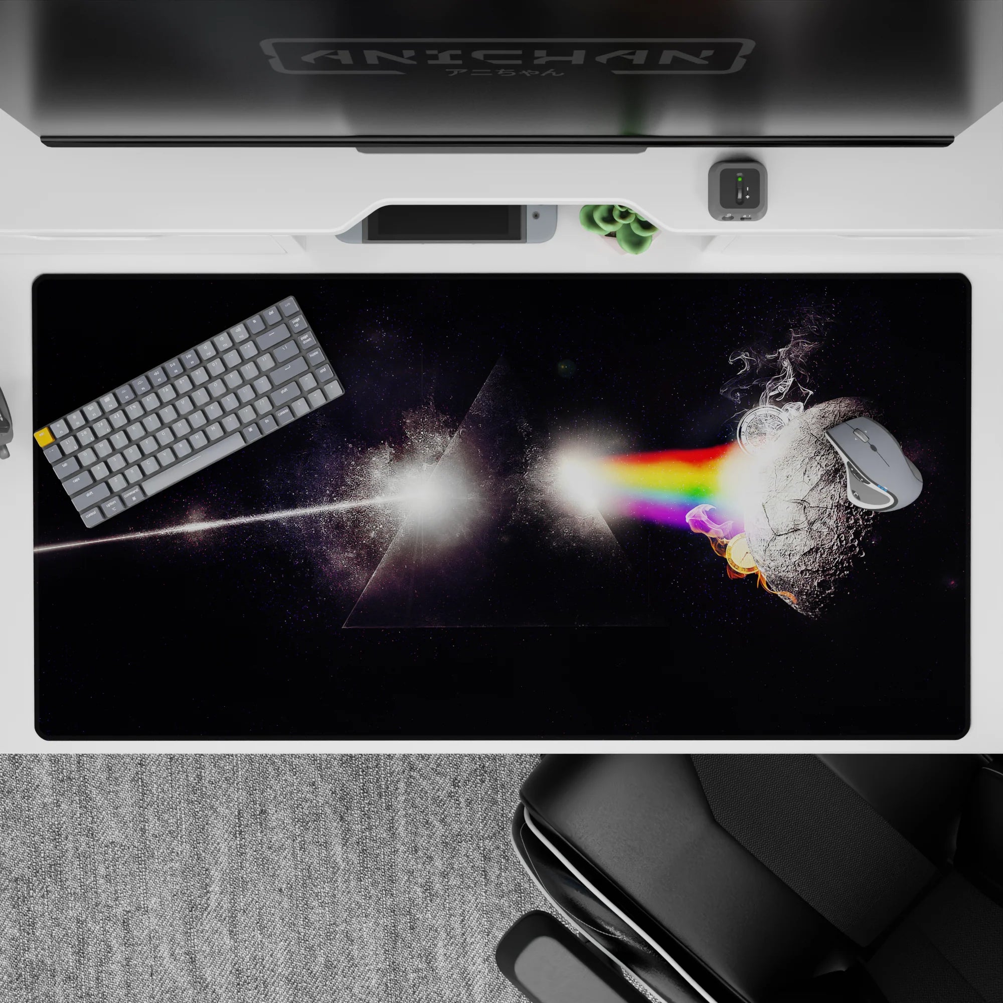 Dark starlit desk pad 40x20 inches with glowing rainbow bands and smoky edges for a calming sci-fi mood.