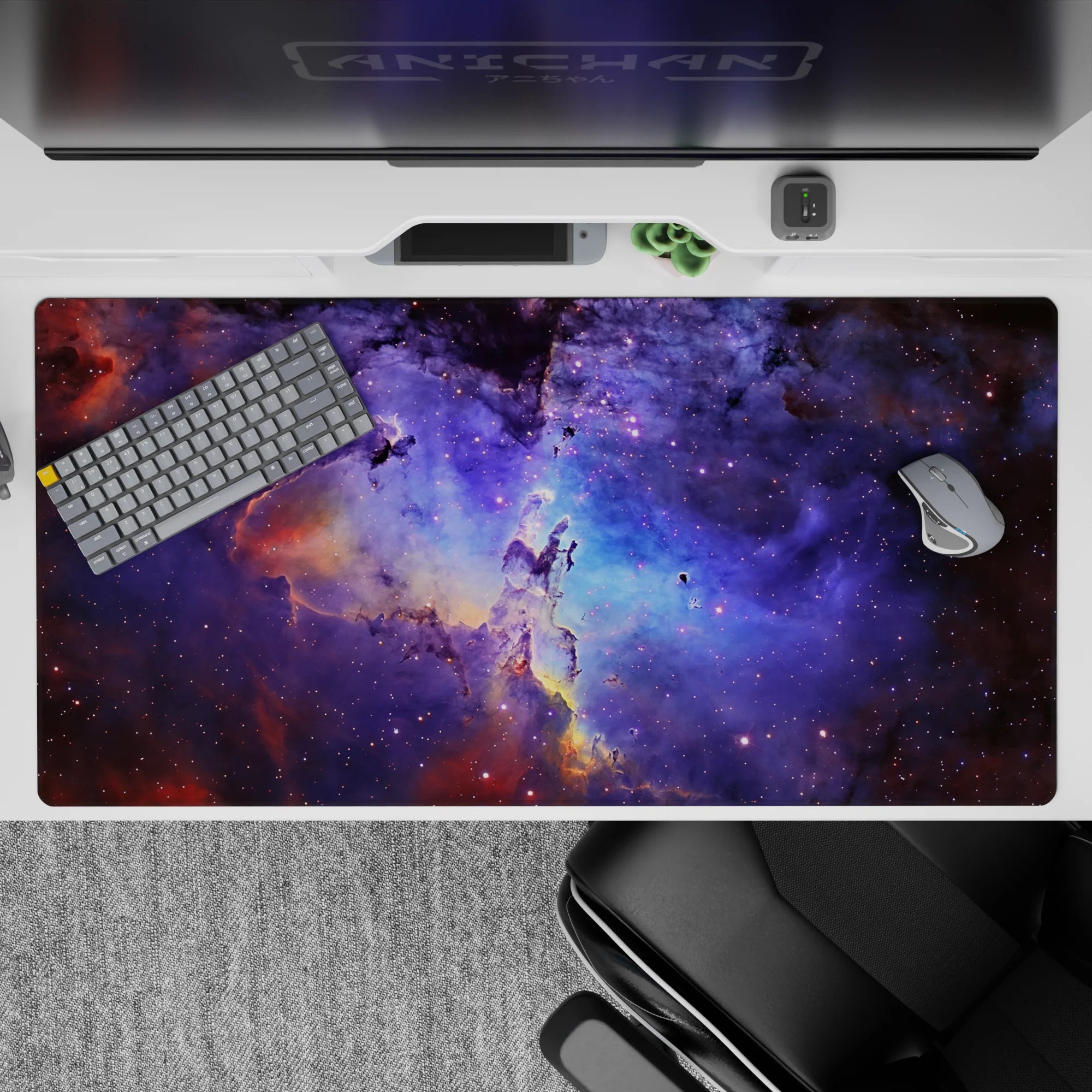 Midnight cosmic desk pad 40x20 inches in navy, violet haze, and soft blue with amber wisps.