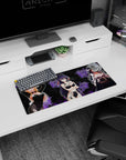 28x12 inches anime girl mouse pad showing blonde bunny-suit girl with two gothic friends in a shadowy scene.