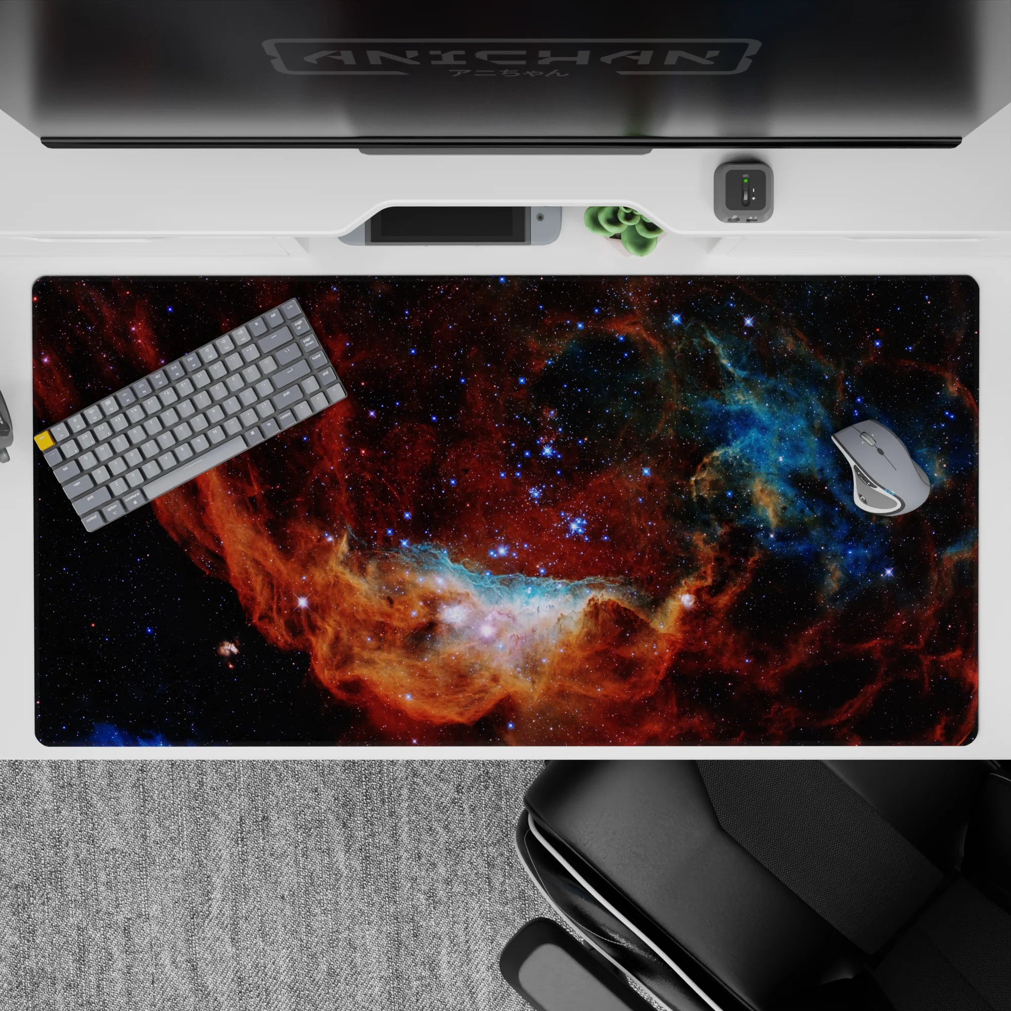 Moody space desk pad 40x20 inches in smoky black, ember red, and deep ocean blue for calmer scrolling.