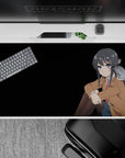 40x20 inches anime desk pad in soft browns and inky black hair with cool blue eyes, cozy dramatic mood.