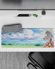 Darkness from Konosuba winks under a dreamy sky on this 32x12 inch anime mouse pad, mixing watercolor clouds and armor.