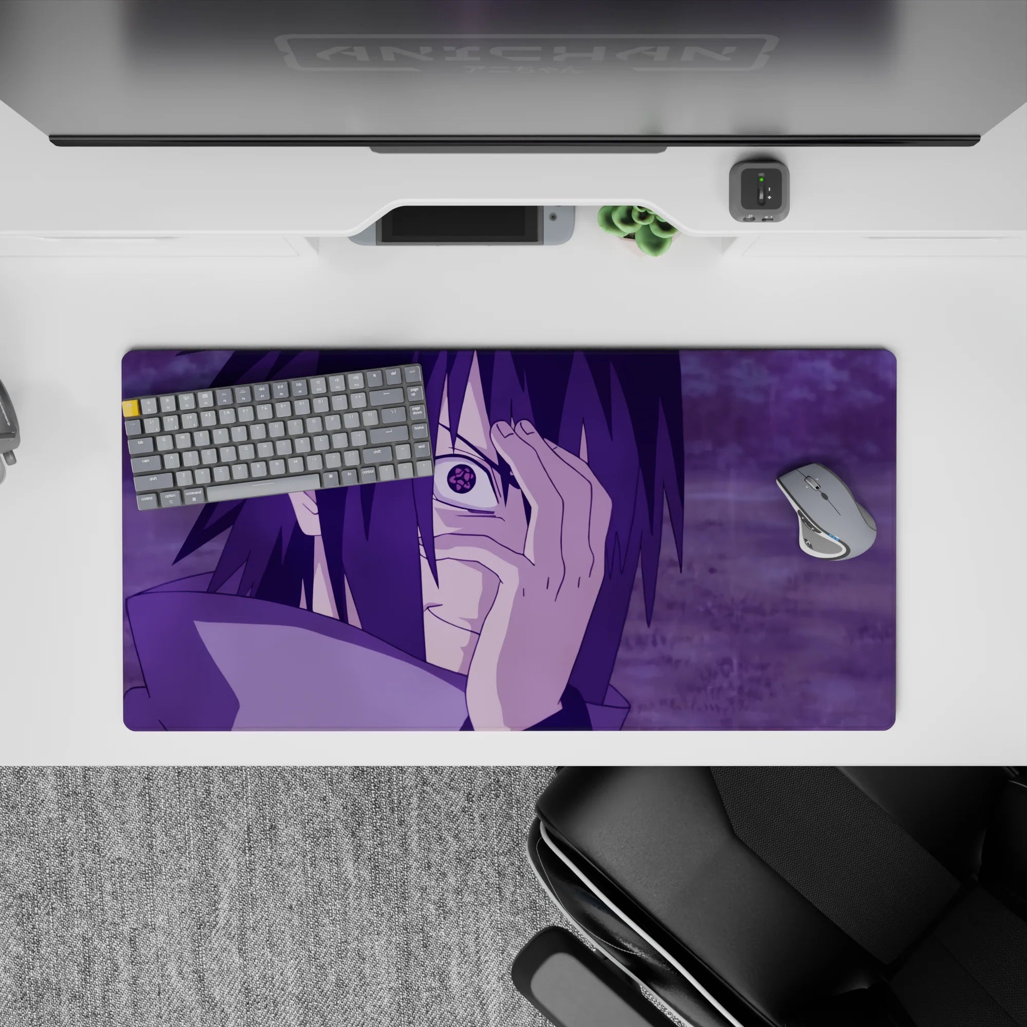 Sasuke Uchiha from Naruto anime mouse pad, 32x16 inches, with Mangekyō Sharingan, purple hues, intense and electrifying design.