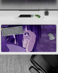 Sasuke Uchiha from Naruto anime mouse pad, 32x16 inches, with Mangekyō Sharingan, purple hues, intense and electrifying design.
