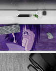 Sasuke Uchiha from Naruto on a 36x16 inch anime mouse pad with Mangekyō Sharingan, purples creating a stormy vibe.