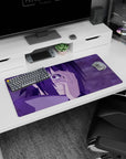 Sasuke Uchiha from Naruto on a 32x16 inch anime mouse pad with Mangekyō Sharingan, purple hues, intense and electrifying.