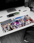 Anime desk pad 36x16 inches showing red-haired swordswoman and violet-haired mage on a tall ship.