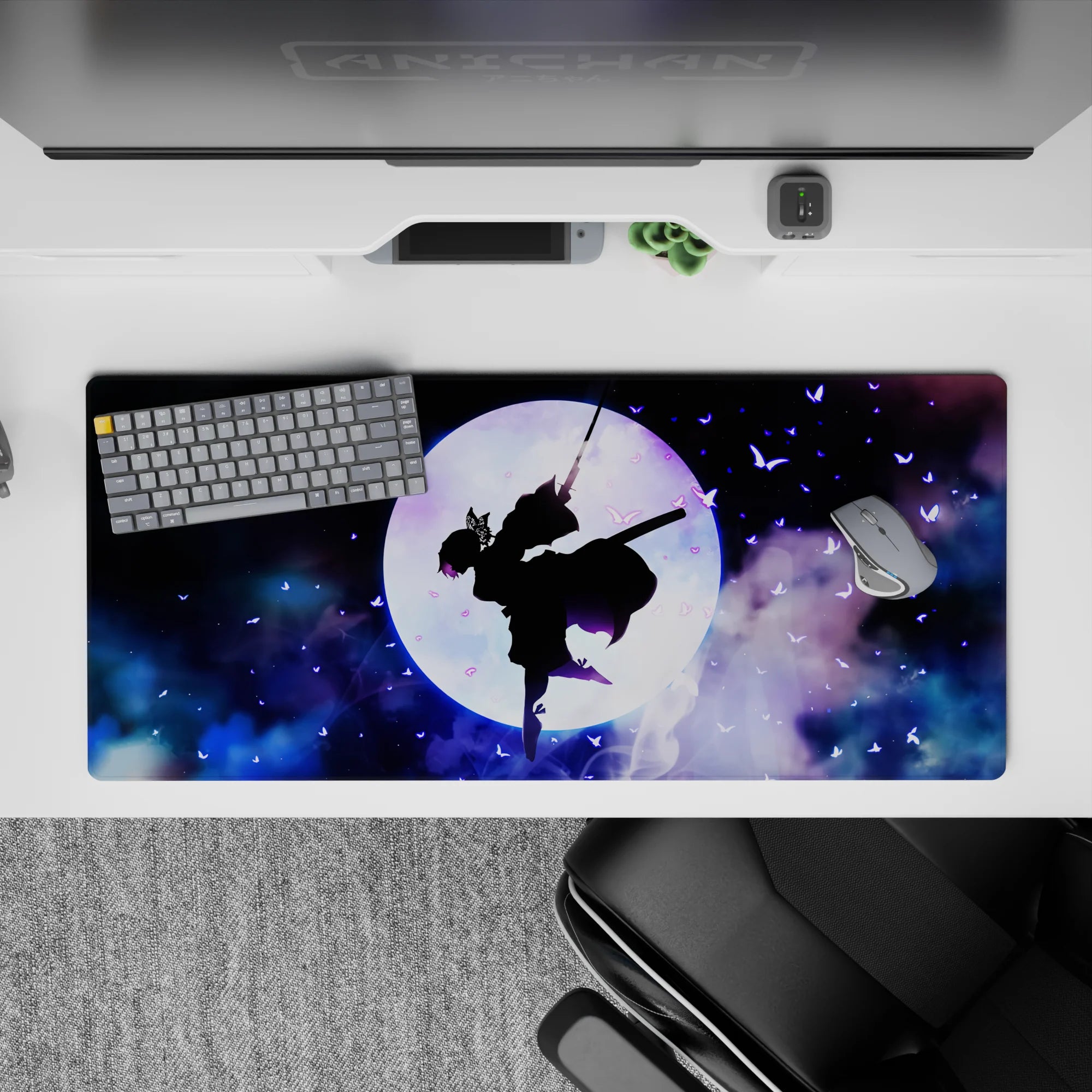 Shinobu silhouette on 36x16 inch anime desk pad, surrounded by violet butterflies and cosmic clouds from Demon Slayer.