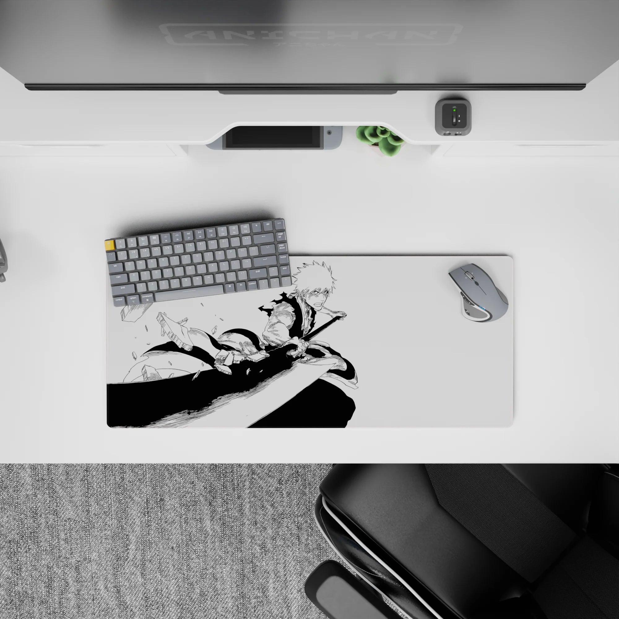 Anime mouse pad 28x12 inches featuring Ichigo from Bleach in a dynamic black-and-white manga style mid-strike action.