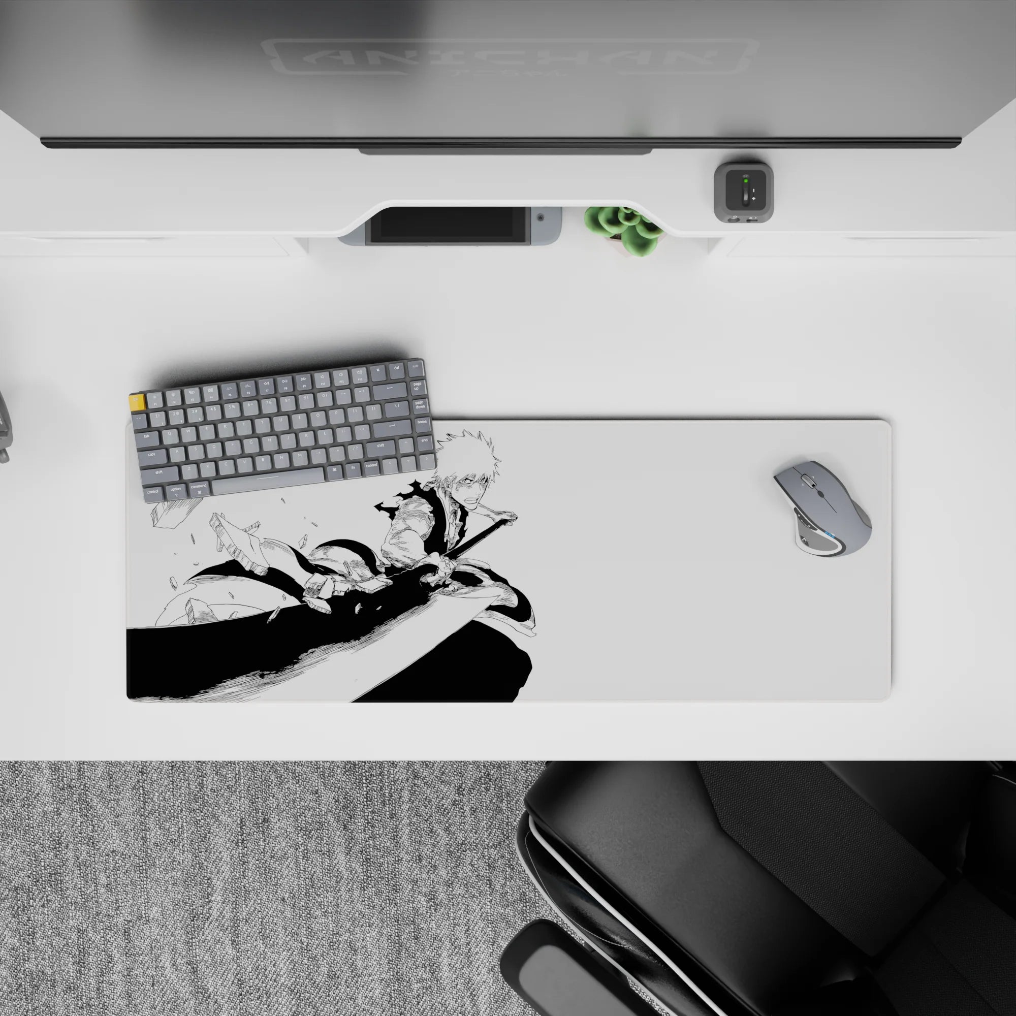 Anime mouse pad featuring Ichigo in mid-strike from Bleach, 32x12 inches, showcasing dynamic monochrome manga art.