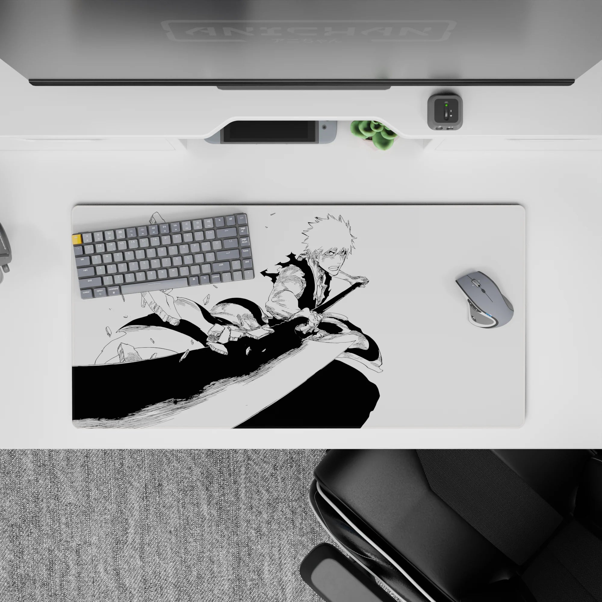 Ichigo from Bleach mid-strike on 32x16 inch anime mouse pad, showcasing dynamic black-and-white manga energy.