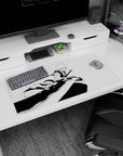 Ichigo from Bleach in mid-strike on a 32x16 inch anime mouse pad, showcasing dynamic black-and-white manga art.