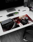 Blonde eyepatch heroine on anime desk pad 36x16 inches, punk angel pose with buckles, red cable line.