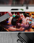 Cozy mischief 40x20 inches anime desk pad in ruby red and caramel glow with jewel-toned charms.