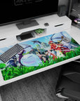 Anime desk pad 40x20 inches featuring red-haired warrior leading, winged blue slime, capes and blades.