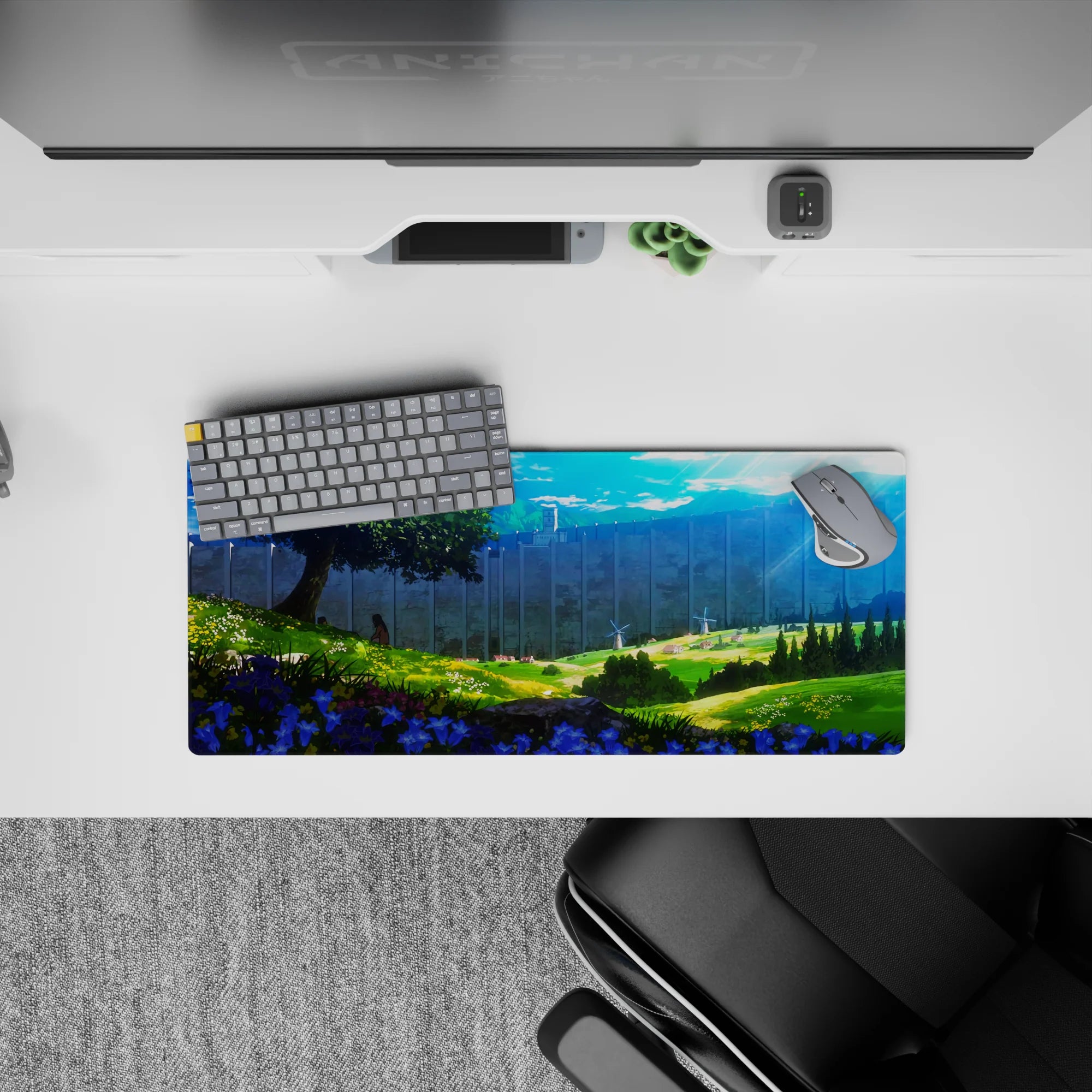 Attack on Titan mouse pad, 28x12 inches, featuring a serene landscape with wildflowers, rolling hills, and a massive wall.