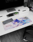 32x12 inches anime mouse pad showing a bright-eyed blue-haired girl lounging on a pillow holding a card.