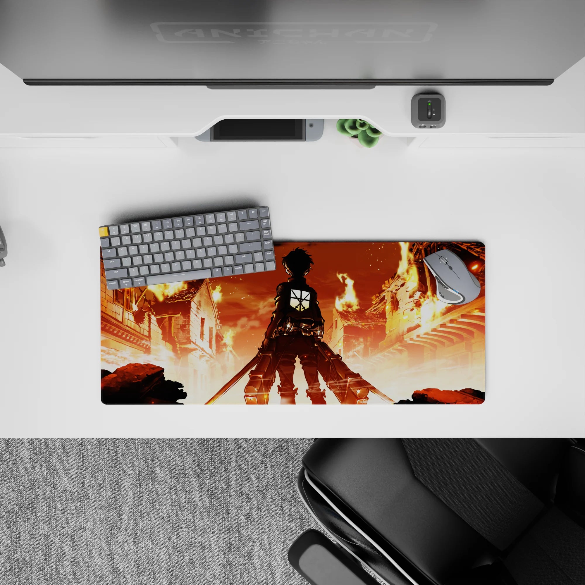 Mouse pad featuring Eren Yeager from Attack on Titan, size 28x12 inches, standing in a fiery cityscape, ready for battle.