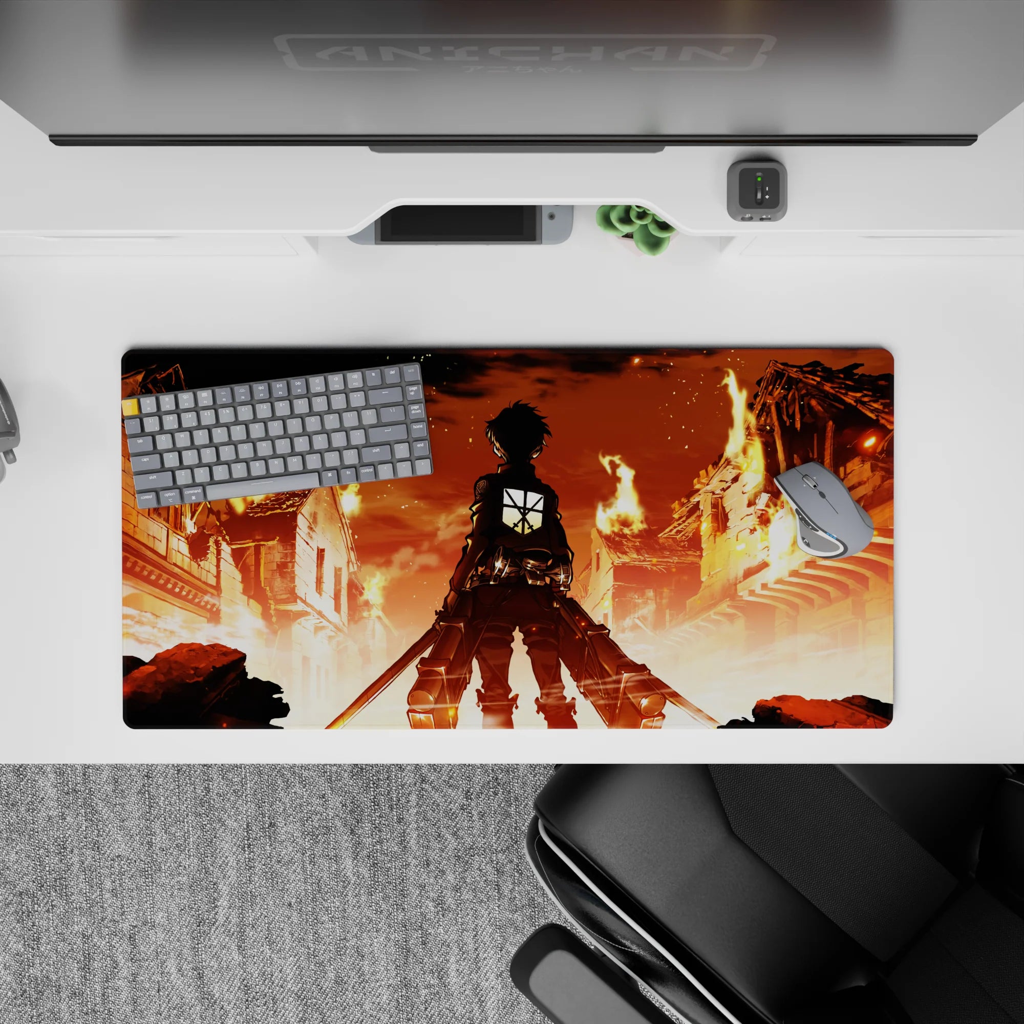 Anime mouse pad 32x16 inches featuring Eren Yeager from Attack on Titan standing against a fiery city backdrop.