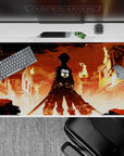 Anime mouse pad 40x20 inches featuring Eren Yeager from Attack on Titan, city in flames, iconic fiery scene.